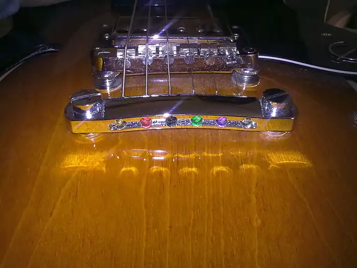 Image of End of guitar bridge assembly