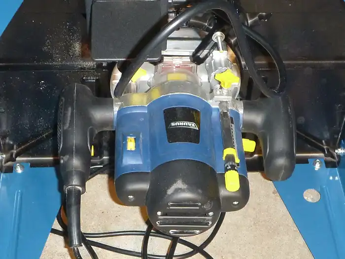 Image of Underneath router table showing attached plunge router