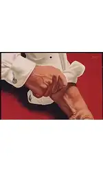 Image of Man Rolling Up His Sleeves