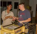 Image of Two Woodworkers Working Together